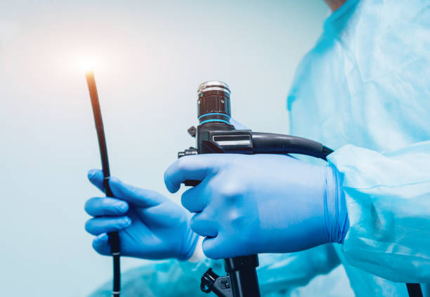 Endoscopy being held by gloved hands of a surgeon